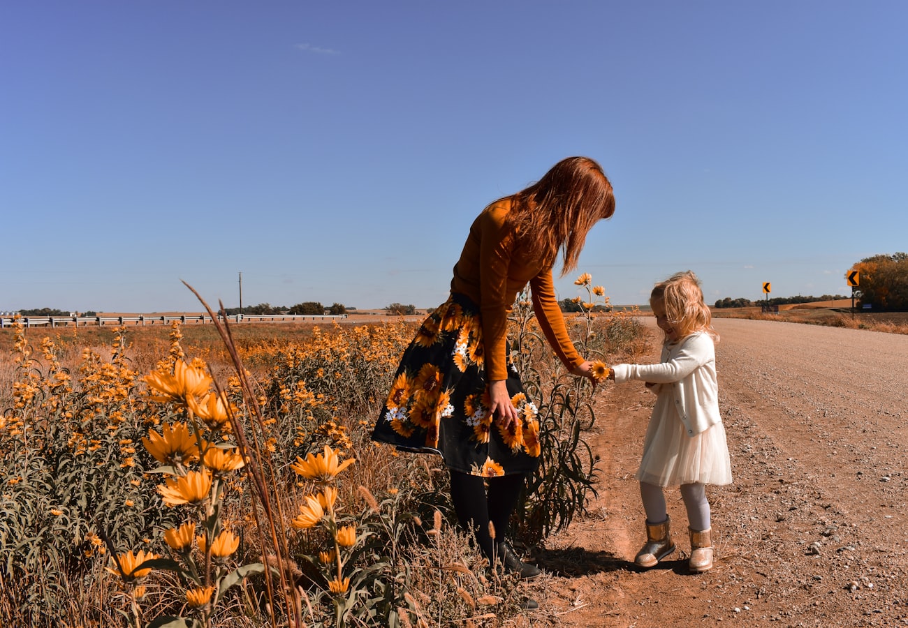 Parent and child outdoors in autumn
